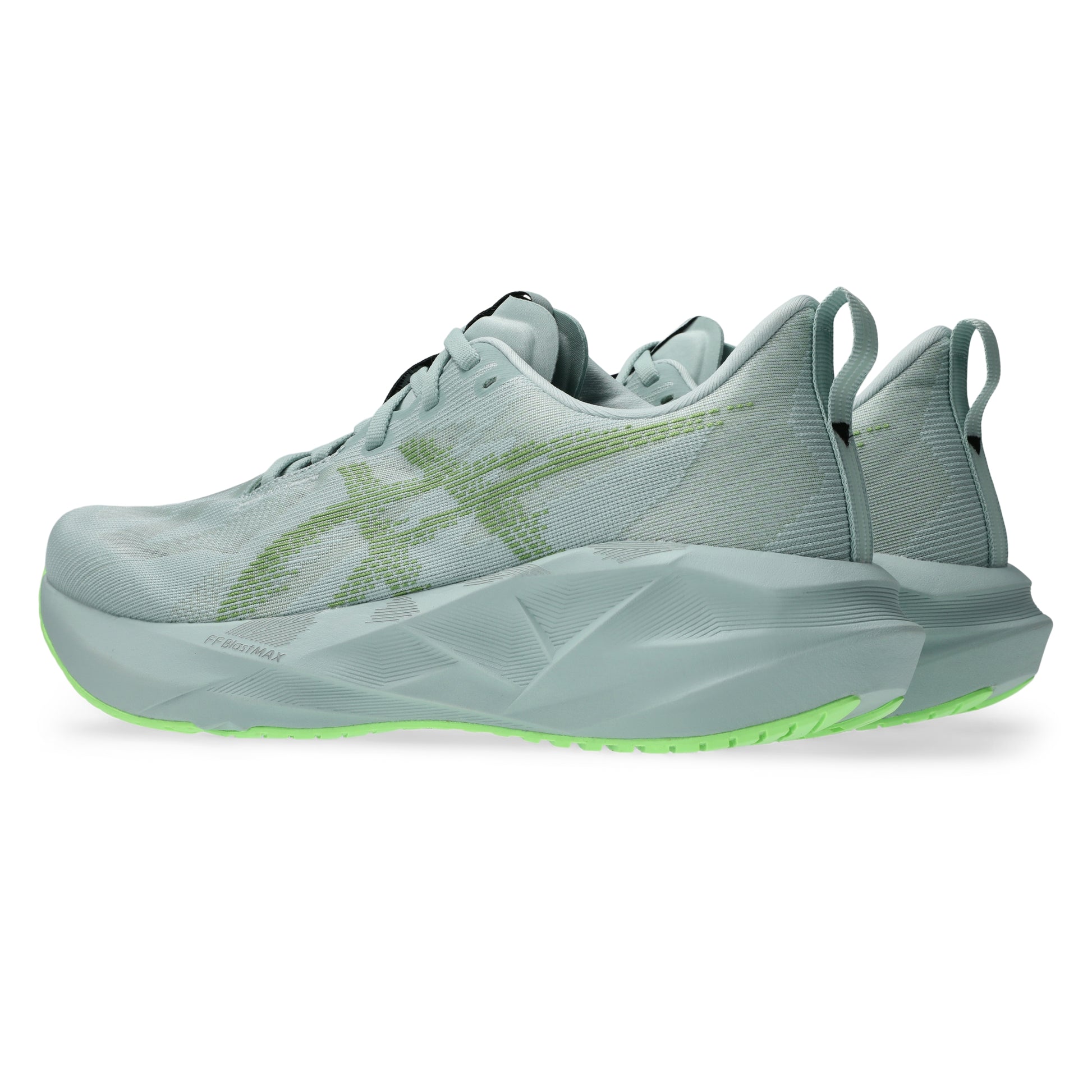 Light blue Asics running shoes with green sole on a white background