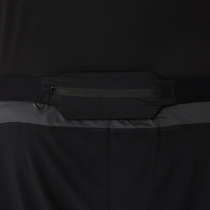 Close-up of a black and gray shorts with a zipper detail on a dark background