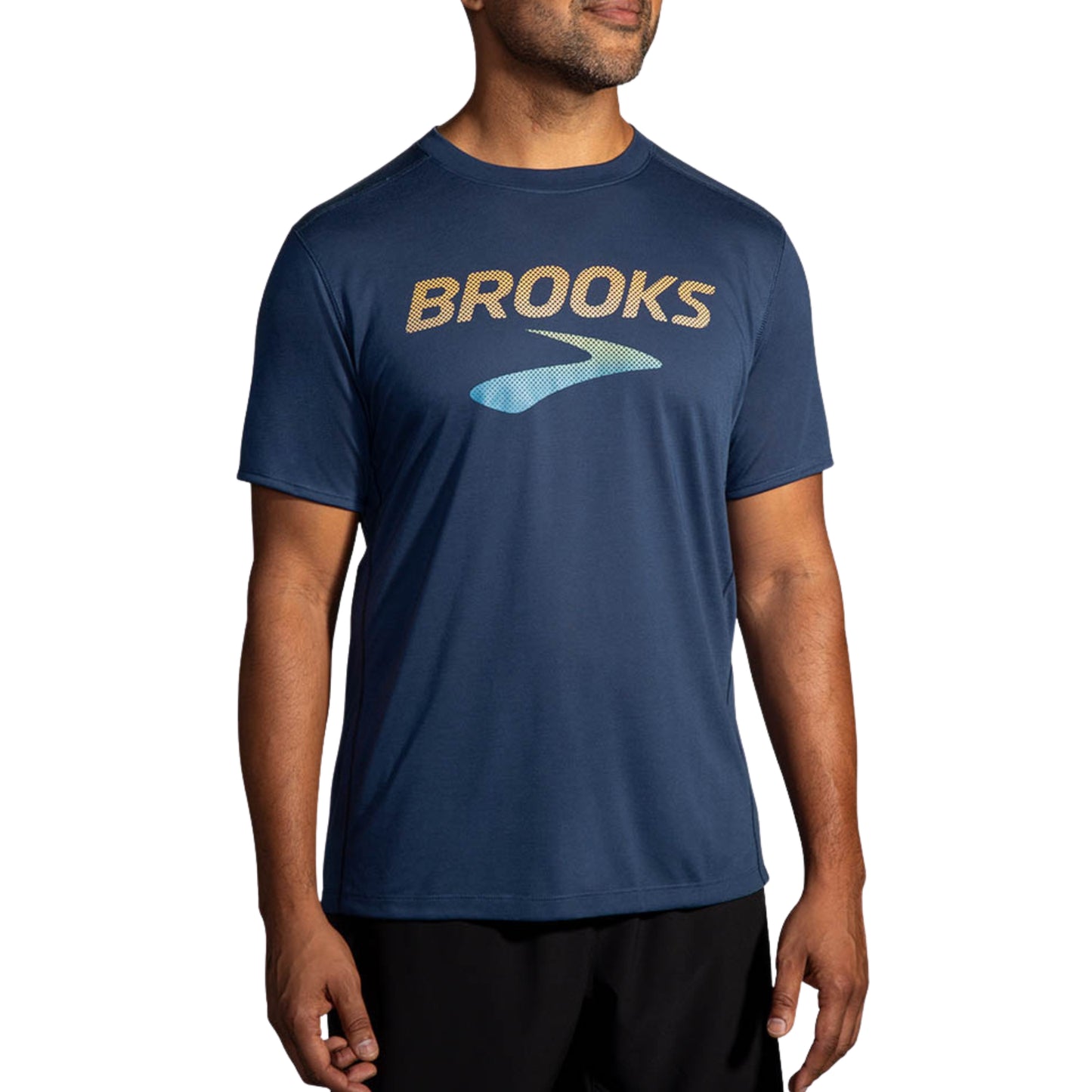 Man wearing a blue 'Brooks' t-shirt on a white background