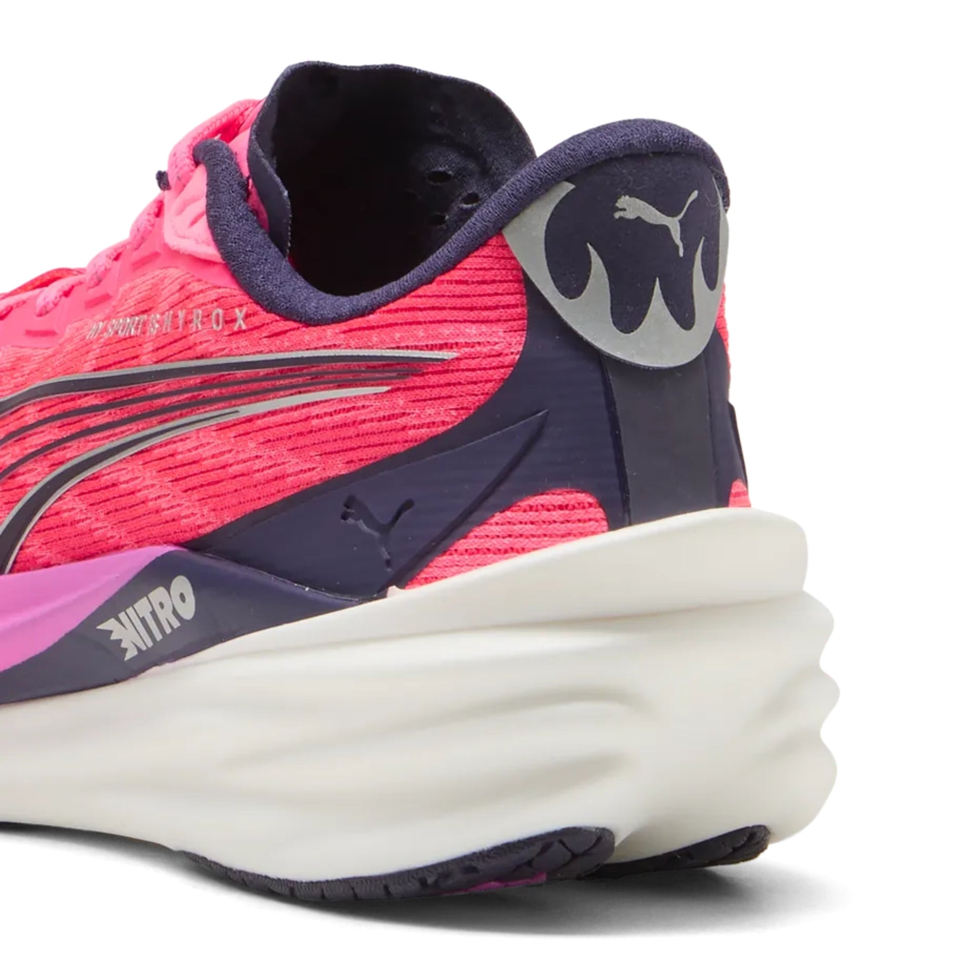 Pink and purple Puma running shoe with white sole on a white background