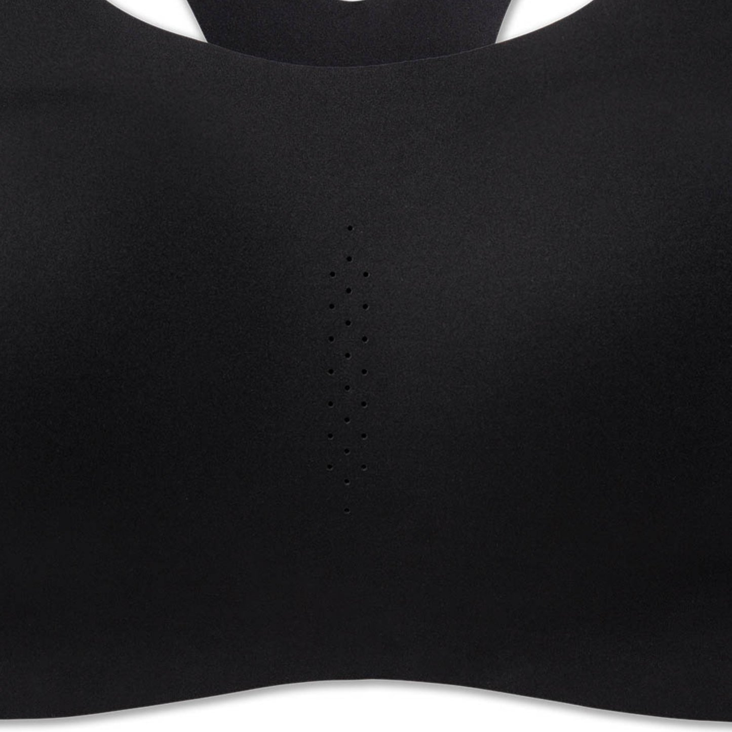 Close-up of a black sports bra or bralette showing the smooth fabric texture, a central perforated ventilation stripe, and the curved neckline against a white background.