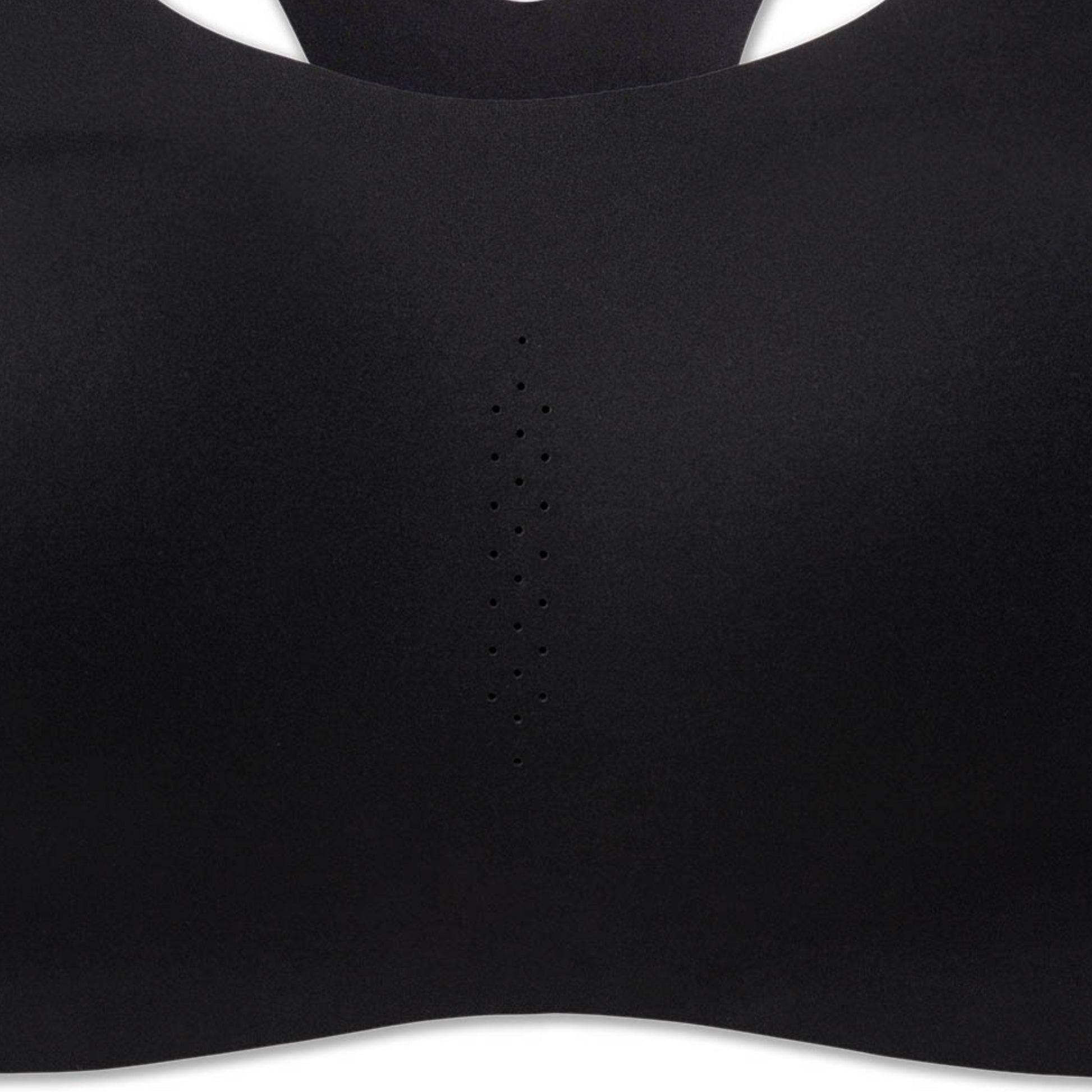 Close-up of a black sports bra or bralette showing the smooth fabric texture, a central perforated ventilation stripe, and the curved neckline against a white background.