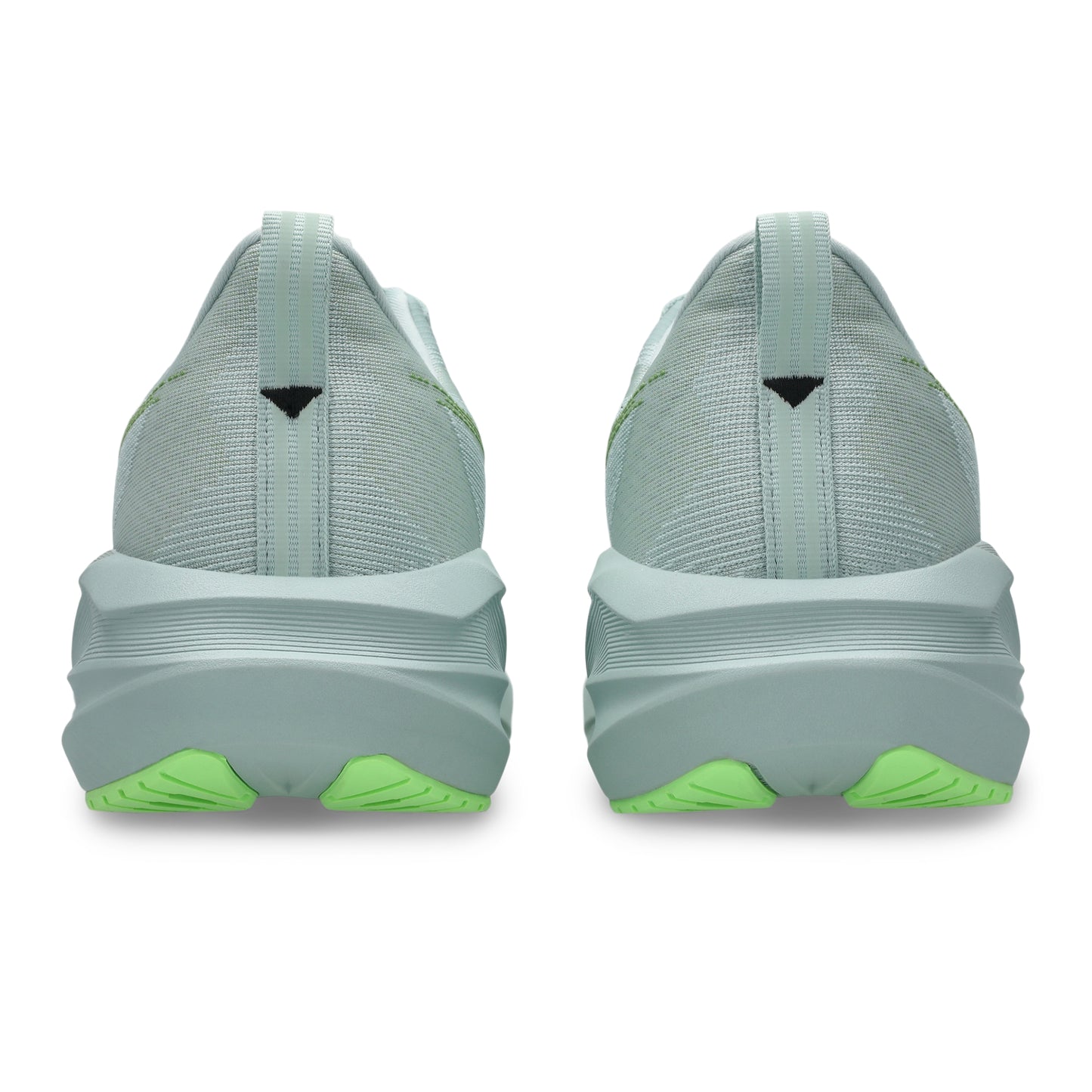 Light blue running shoes with green accents on a white background
