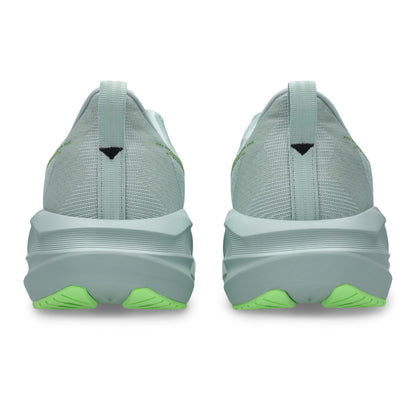 Light blue running shoes with green accents on a white background