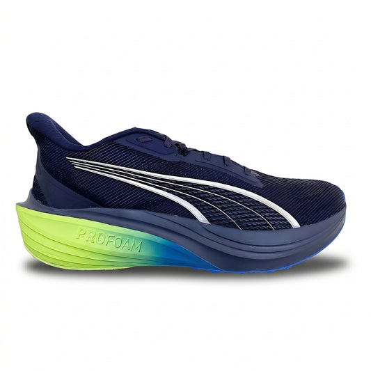 Navy Puma running shoe with green sole on a white background
