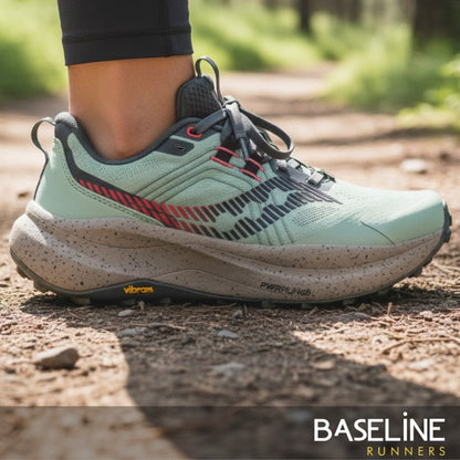 Trail running shoe on a dirt path with 'Baseline Runners' branding.