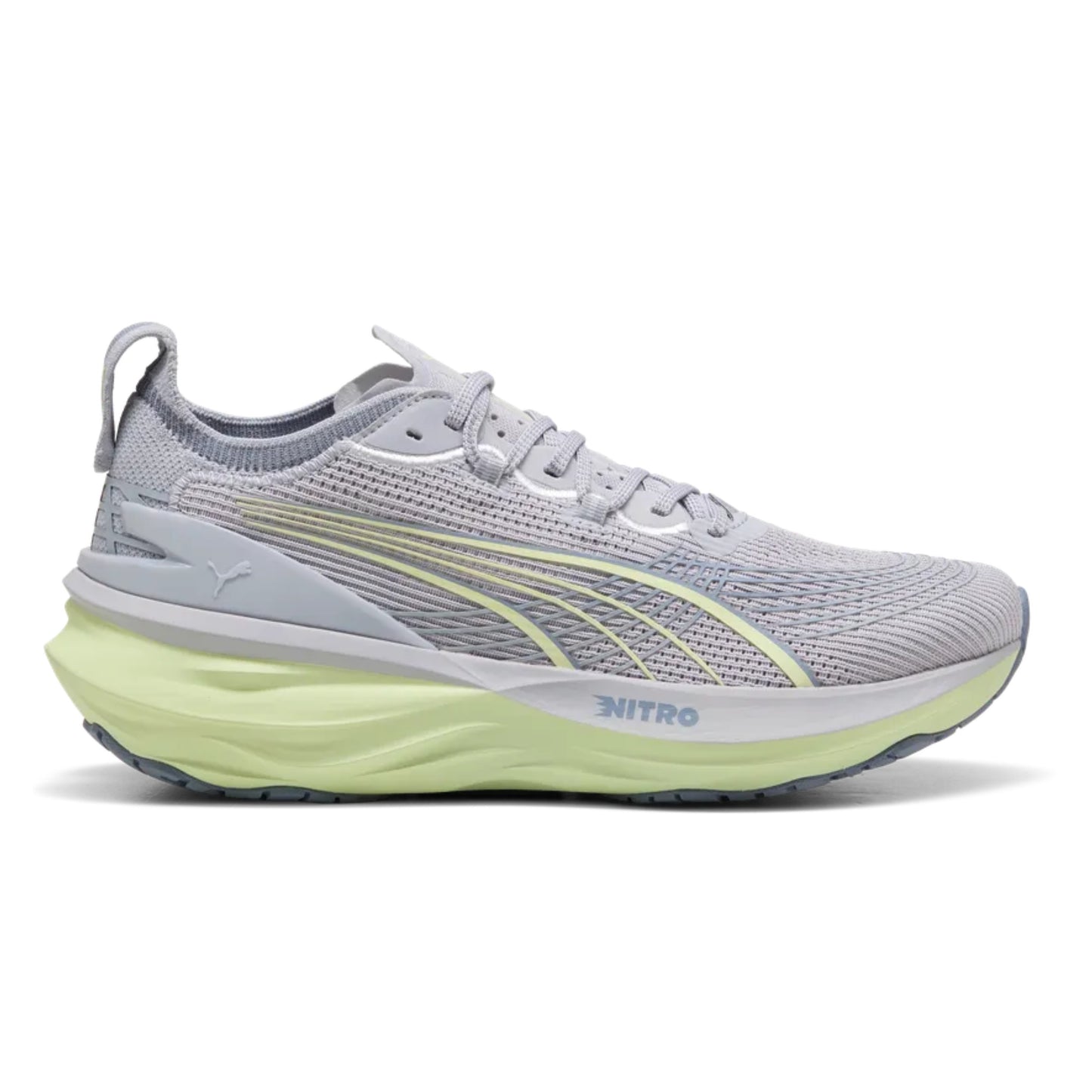 Gray Puma running shoe with green sole on a white background
