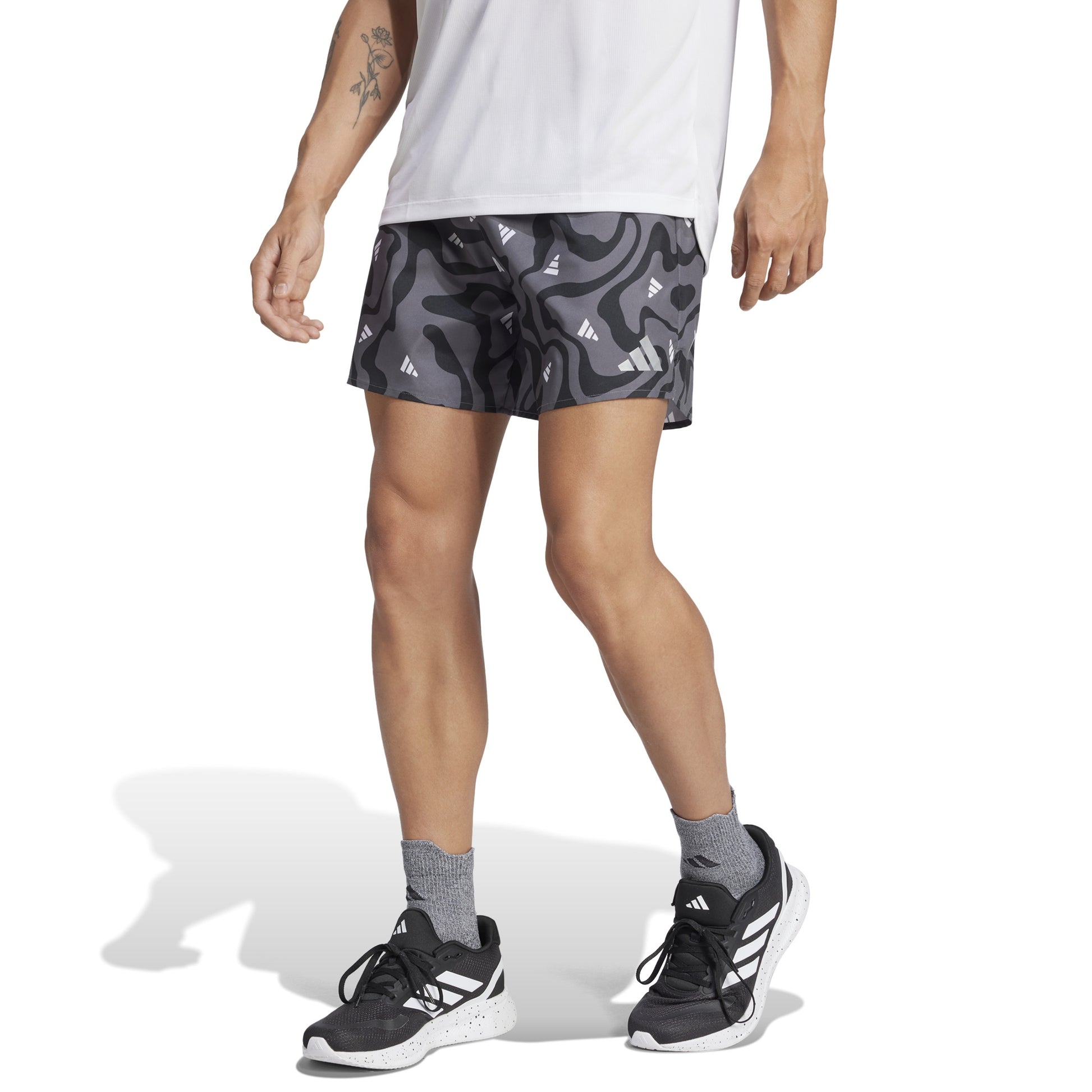 Man wearing Adidas grey patterned short 
