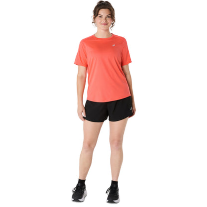 Person wearing a coral Asics shirt on a white background