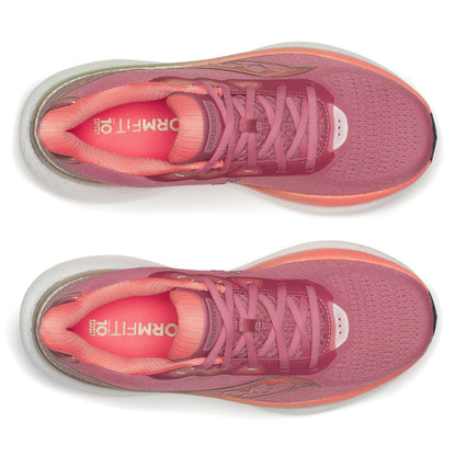 Pink Saucony running shoes with a white sole on a white background