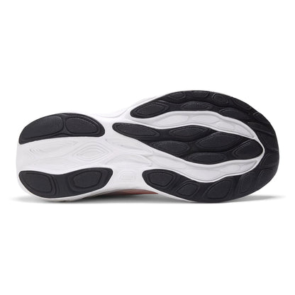 Close-up of a running shoe sole with black and white design on a white background