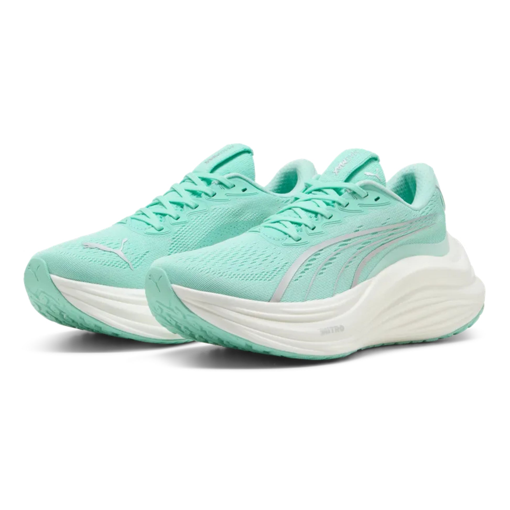 Pair of mint green running shoes with white soles on a white background