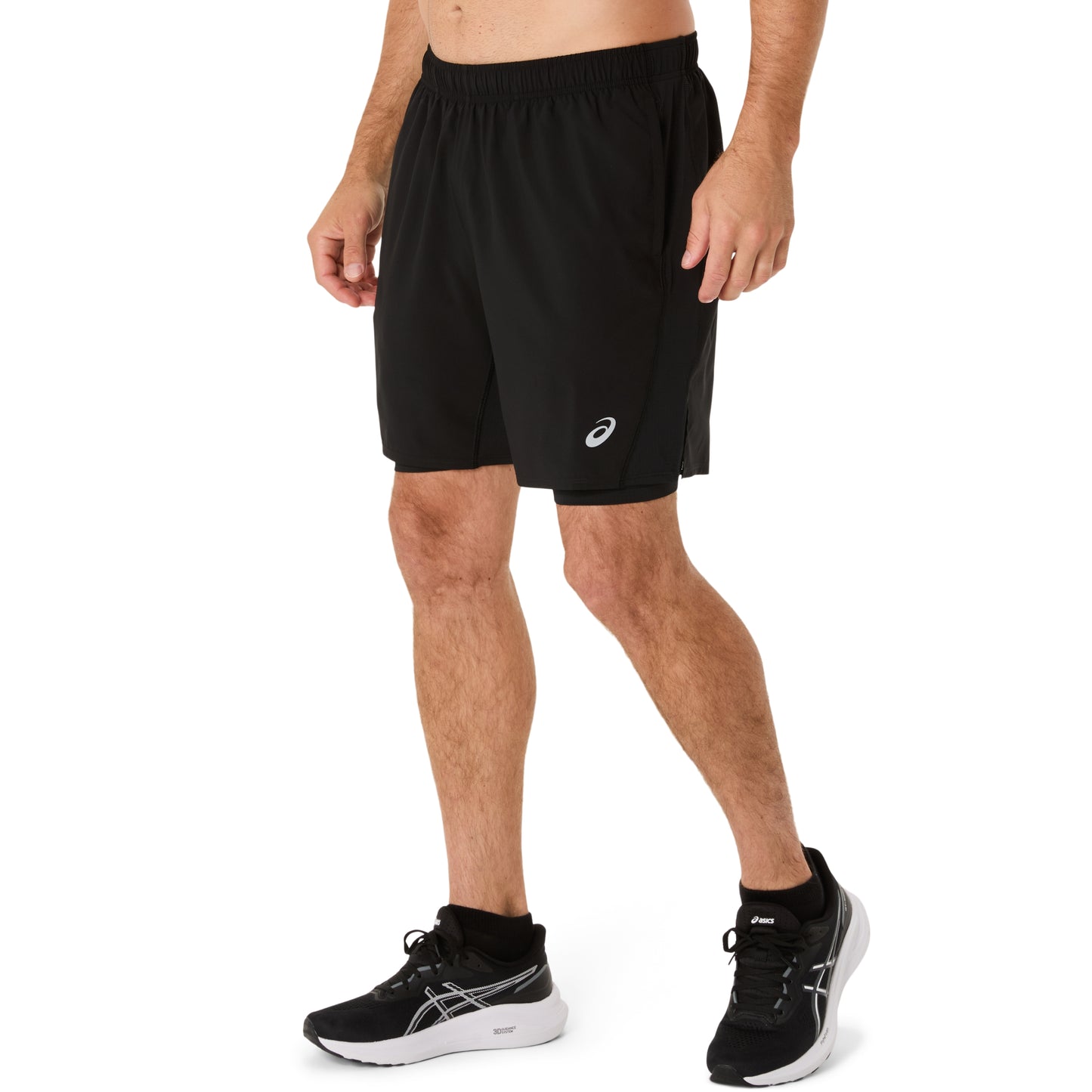 Person wearing black running shorts with a brand logo on a white background