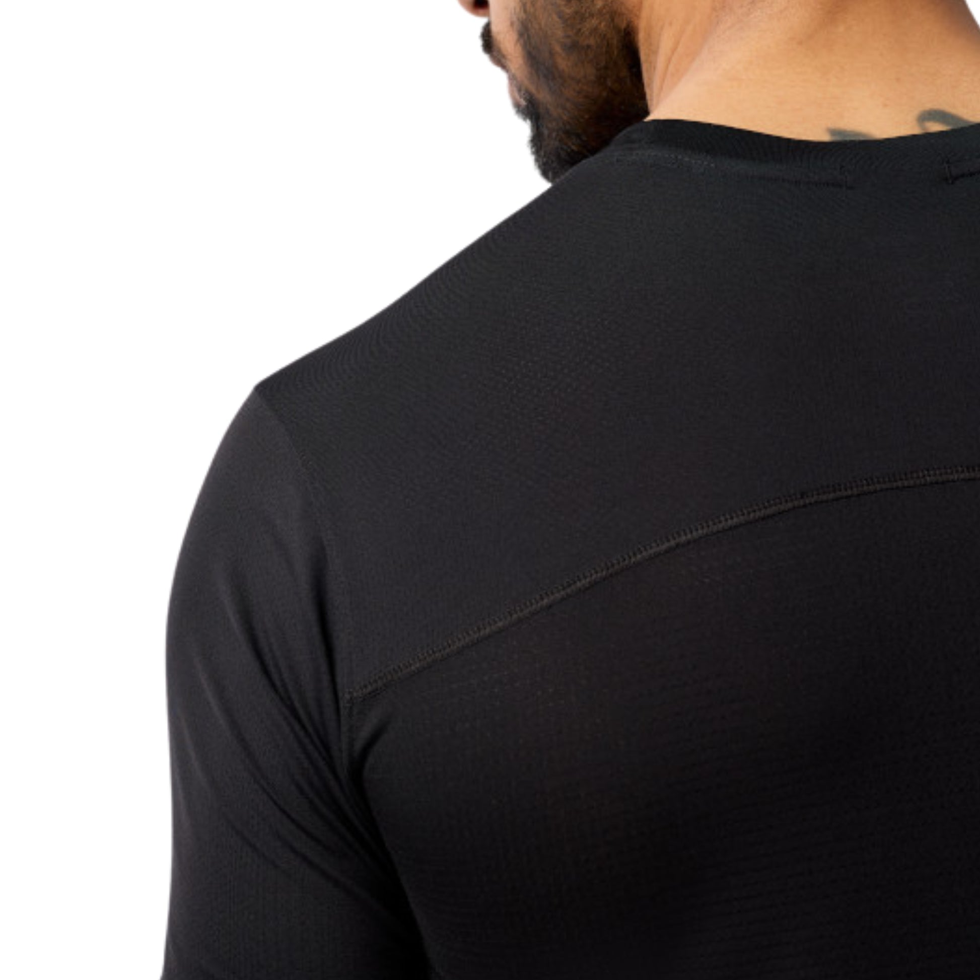 Black shirt worn by a person on a white background