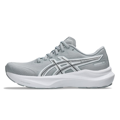 Gray running shoe with white sole on a white background