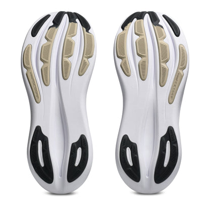 Close-up of white running shoes with black and beige accents on a white background