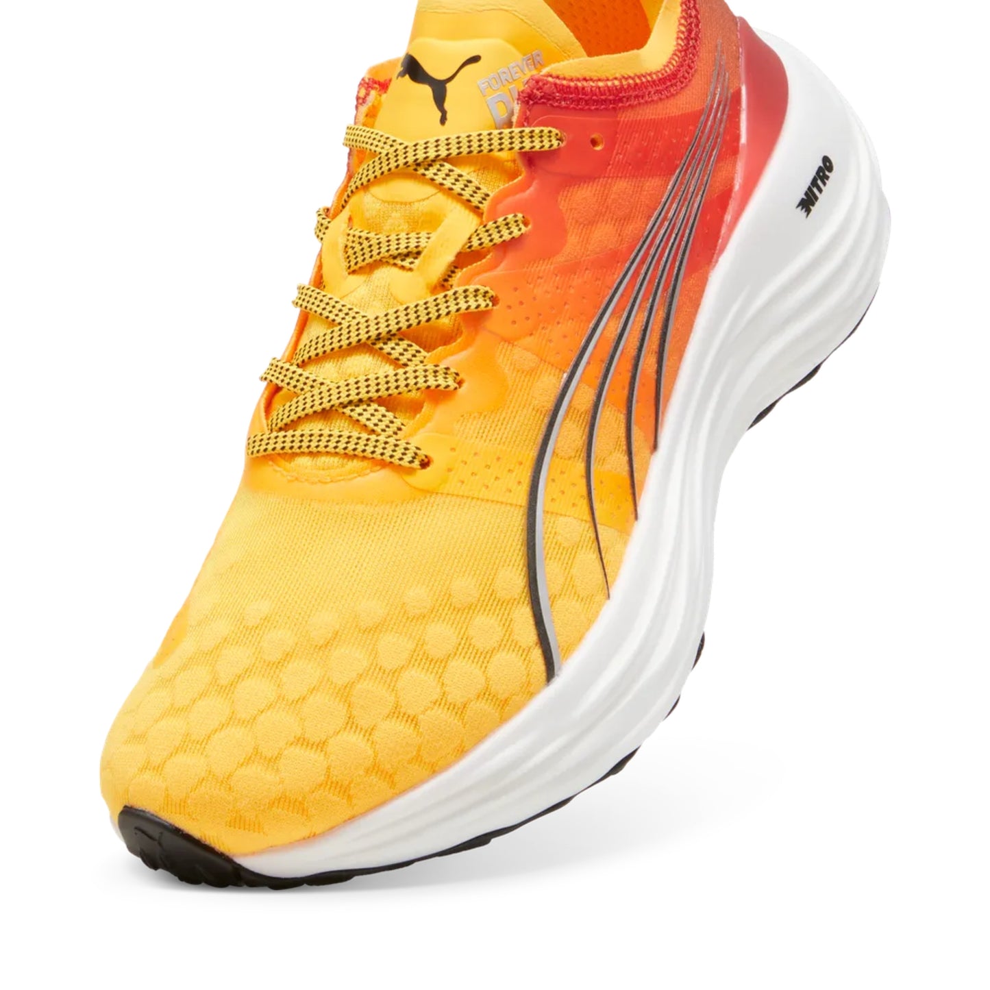 Yellow and orange Puma running shoe with white sole on a white background