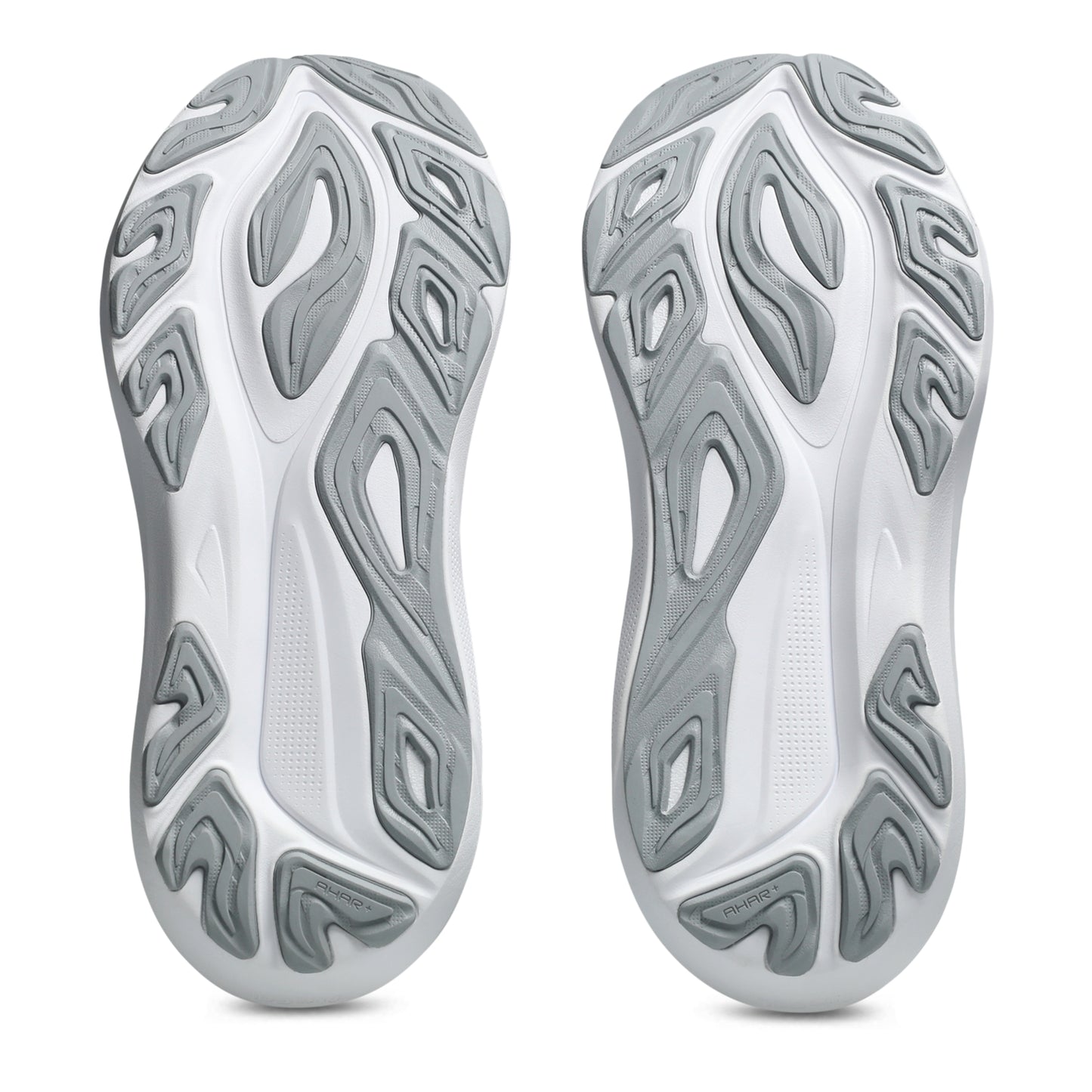 Close-up of white and gray shoe soles with unique tread pattern on a white background