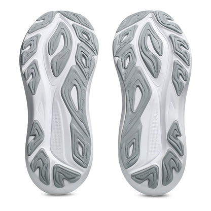Close-up of white and gray shoe soles with unique tread pattern on a white background
