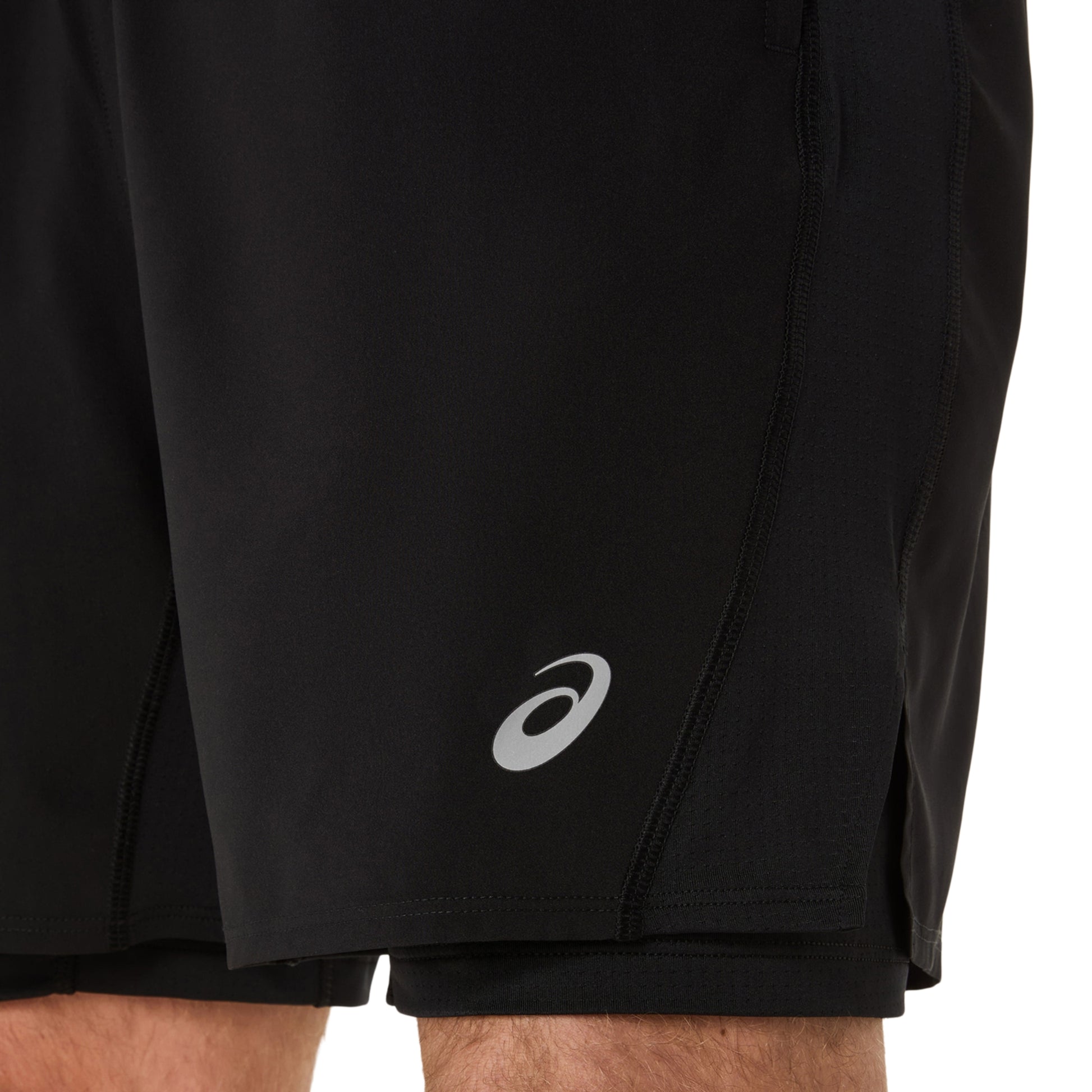Black running shorts with a white logo on a white background
