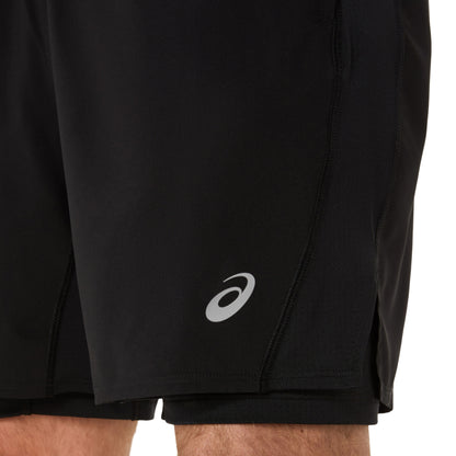 Black running shorts with a white logo on a white background
