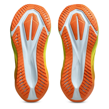 Bottom view of a Asics running orange shoe sole with a tread pattern on a white background